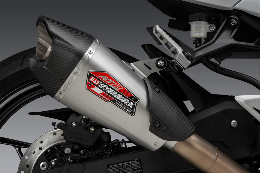 Yoshimura Muffler Name Badge Stainless AT2 – lifestyle photo (YM5-NB002)